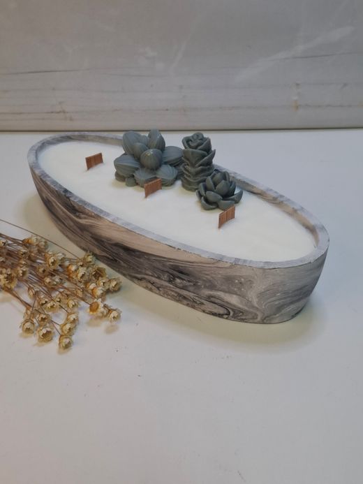 Vela artesanal en recipiente ovalado efecto mármol