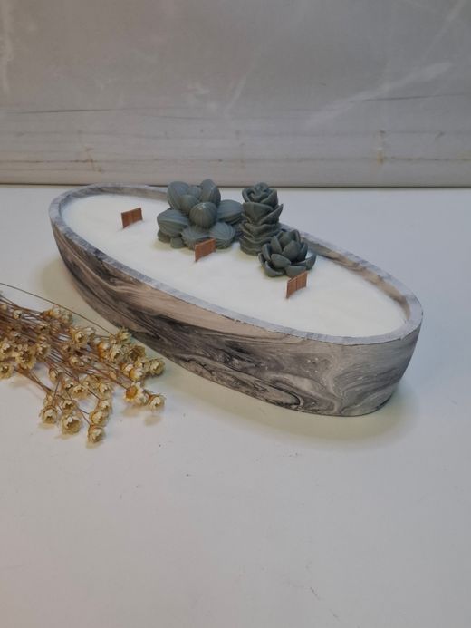Vela artesanal en recipiente ovalado efecto mármol