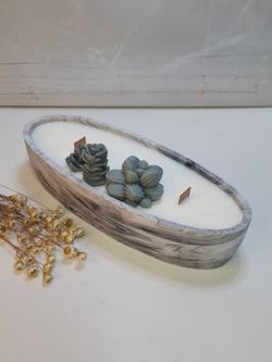 Vela artesanal en recipiente ovalado efecto mármol