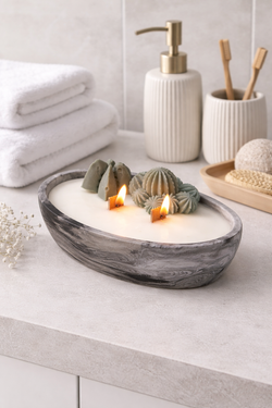 Vela artesanal efecto mármol en recipiente ovalado