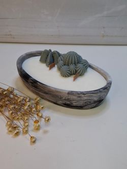 Vela artesanal efecto mármol en recipiente ovalado